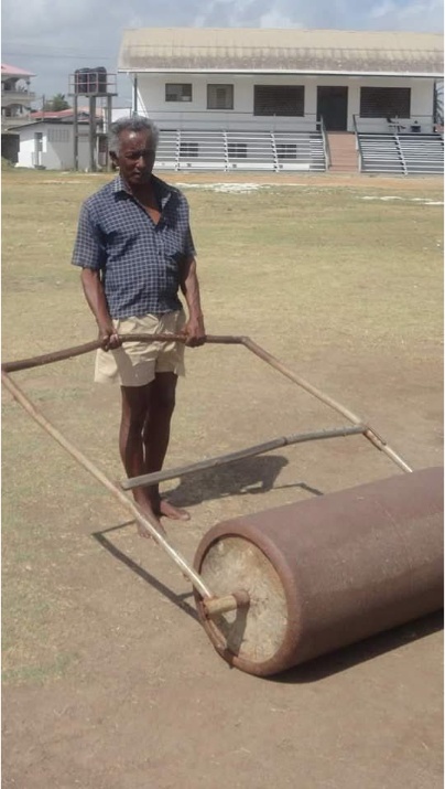 Paul Singh rolling the cricket pitch at Better Hope